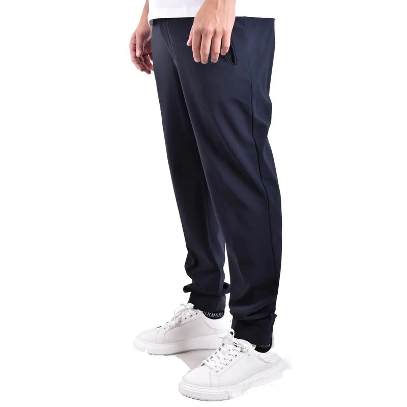Black armani joggers with sleek tapered fit and subtle side seam detailing paired with rrd men blue polyamide trousers