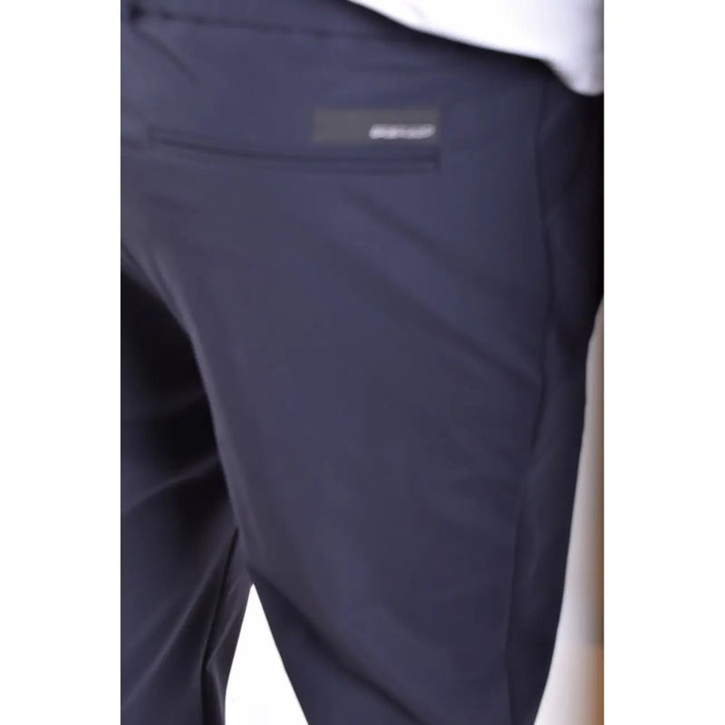 Dark navy blue RRD men polyamide trousers with subtle texture and small rectangular brand label on back pocket backside view