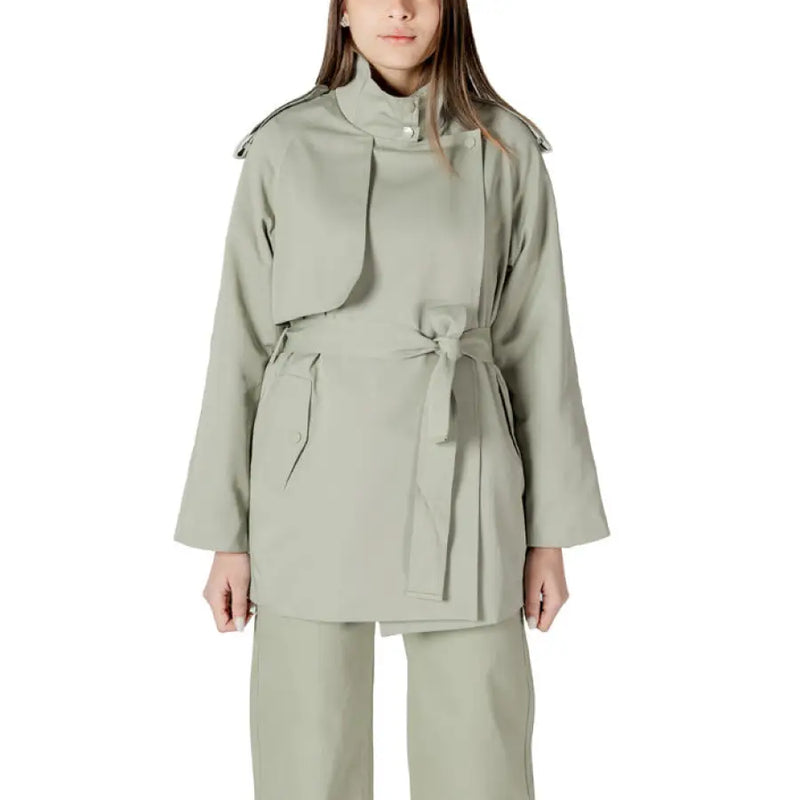 Women’s sage green belted trench coat displayed with a stylish belt and classic design