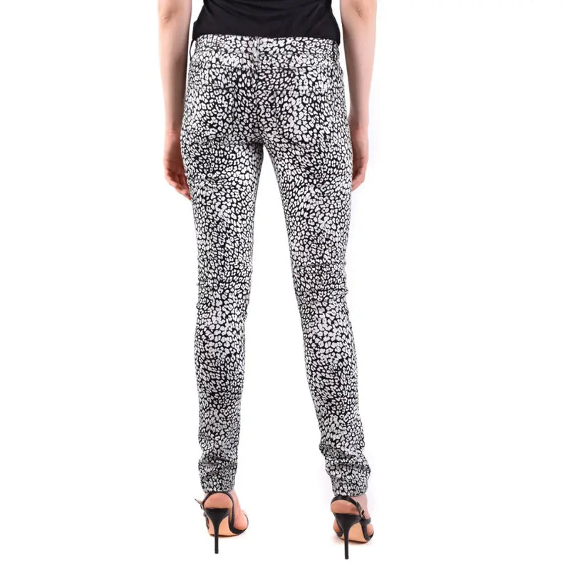 Saint Laurent white leopard print women jeans featuring black and white skinny leopard print design