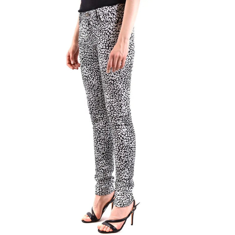 Saint Laurent white leopard print women jeans featuring black and white skinny denim with a bold animal pattern