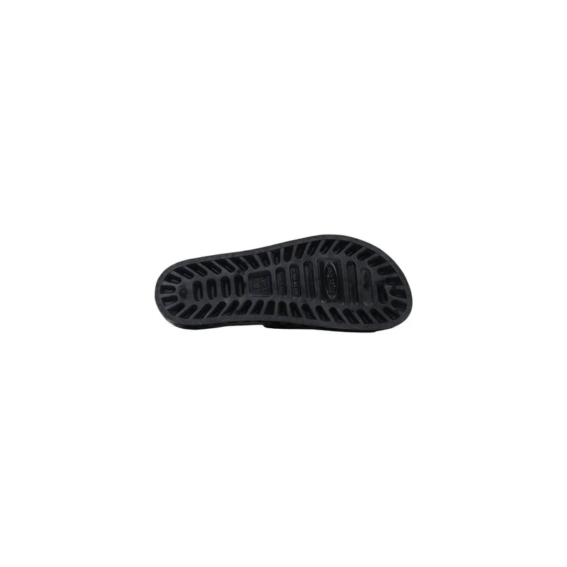 Black rubber sole of sensi men slippers la jolla urban black pvc open toe with textured grooves and embossed brand logo