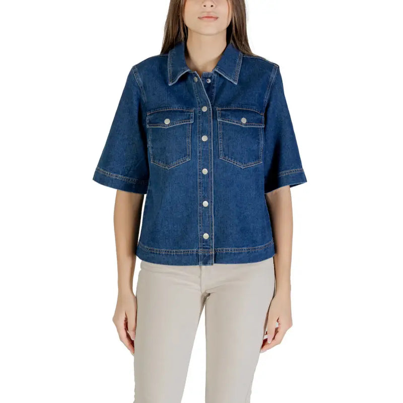 Classic blue short sleeve cotton shirt for women with chest pockets and light-colored buttons