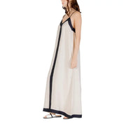 Elegant sleeveless floor-length dress with dark trim suitable for formal occasions