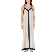 Sleeveless floor length dress with dark trim and black accents displayed in the product image