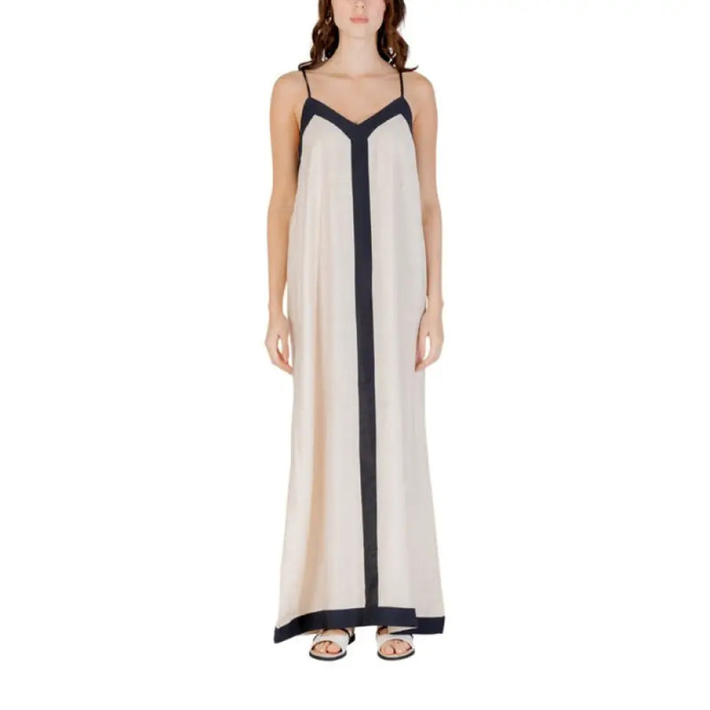 Sleeveless floor length dress with dark trim and black accents displayed in the product image