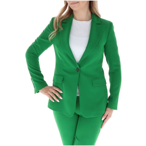 Sol wears women green blazer with lapel collar vibrant tailored single button closure and flap pockets