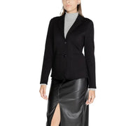 Women wearing Street One black tailored blazer over grey turtleneck and leather midi skirt