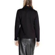 Woman wearing a black blazer and leather skirt from Street One for a sophisticated look