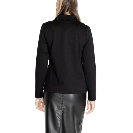 Woman wearing a black blazer and leather skirt from Street One for a sophisticated look