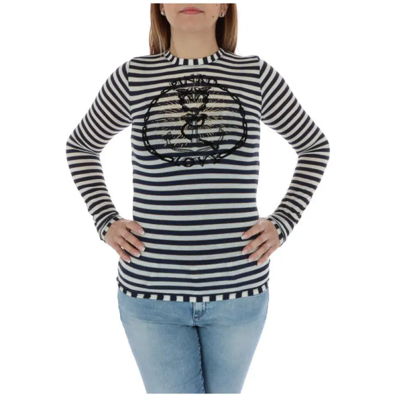 Women striped long sleeve shirt with anchor embellishment displayed in product image