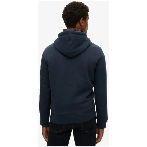 Men’s navy blue hooded sweatshirt with front pockets from Superdry for casual wear