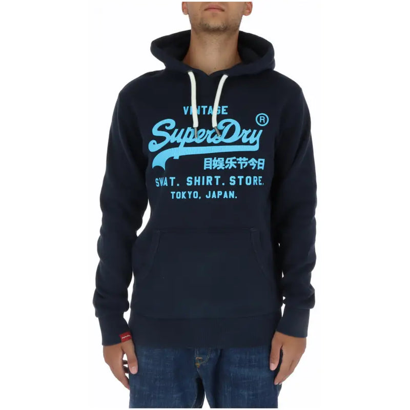 Navy blue Superdry men’s printed sweatshirt with light blue vintage logo, white drawstrings, and front pockets