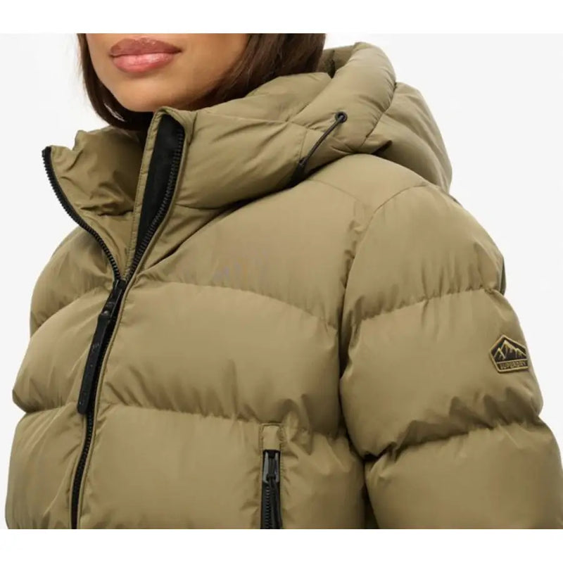 Superdry women green hooded quilted polyester jacket with black zippers and branded mountain logo patch on sleeve
