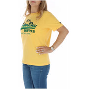 Yellow superdry women t-shirt with green logo and English and Chinese text from fall winter collection