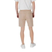 Beige cotton tan drawstring shorts shown from the back with a drawstring waist and two back pockets