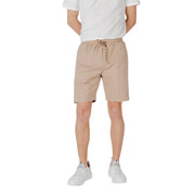 Tan drawstring shorts made of beige cotton with a drawstring waistband and subtle side pockets for casual wear