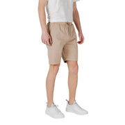 Tan drawstring shorts made of beige cotton with a drawstring waistband and subtle side pockets for casual wear