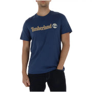 Navy blue Timberland men t-shirt with gold-colored logo and tree emblem across the chest in cotton material
