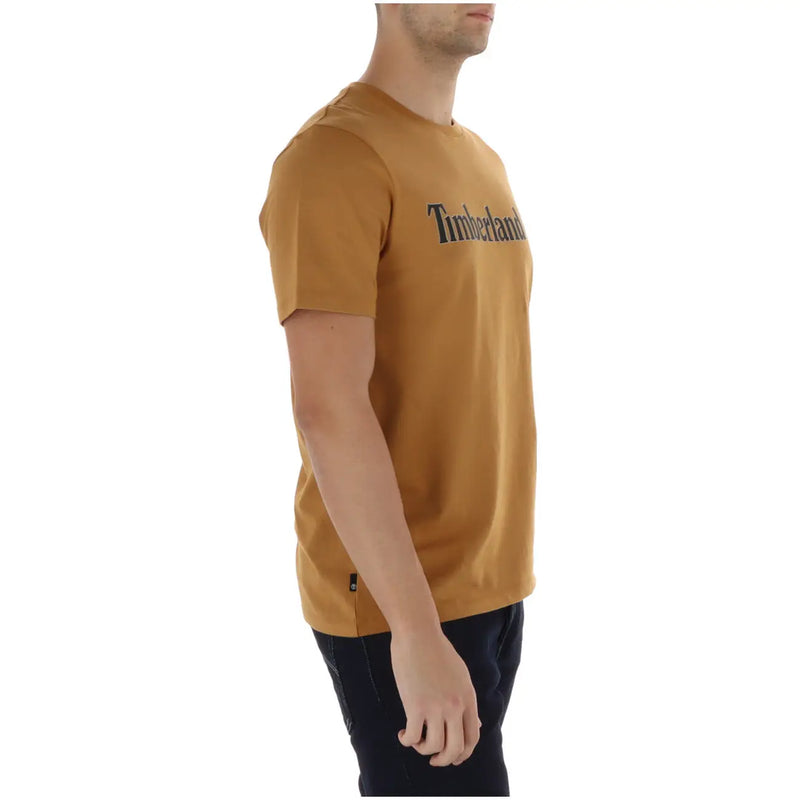 A mustard-yellow Timberland men t-shirt made of timberland fabric with a black logo across the chest