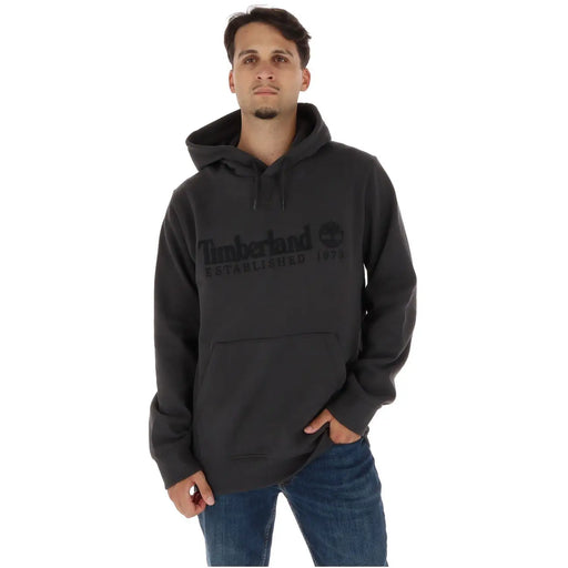Black timberland men hoodie with subtle logo and established 1872 text made of cotton fleece with pockets