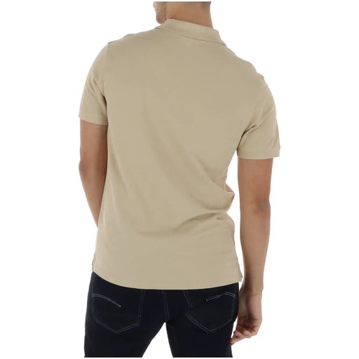 Beige Timberland men polo shirt made of cotton with short sleeves, classic collar, and neat stitching