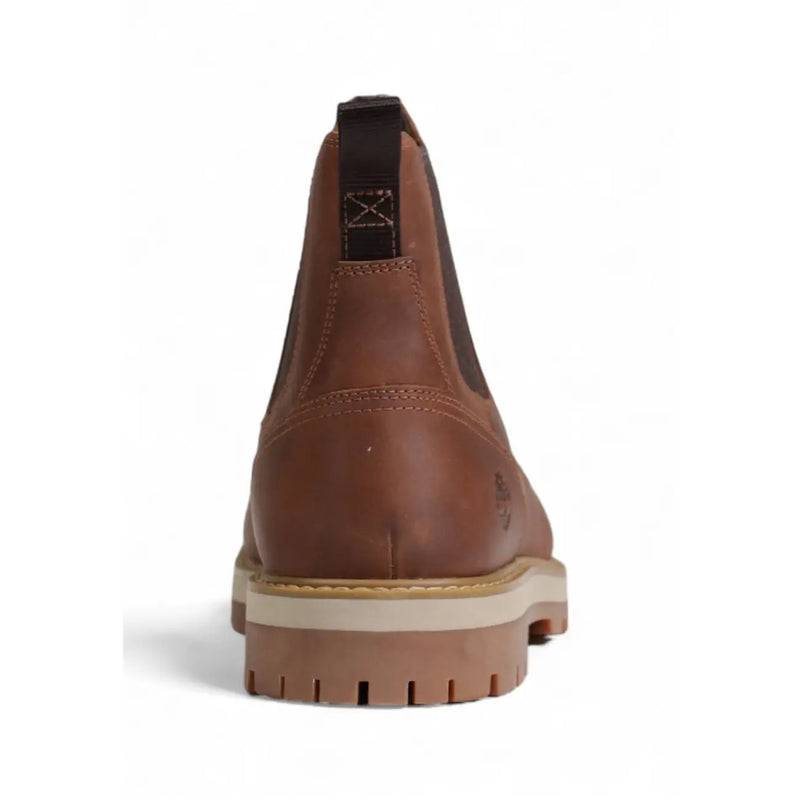 Timberland mens brown leather chelsea boot with tan rubber sole and black pull tab shown from the back side