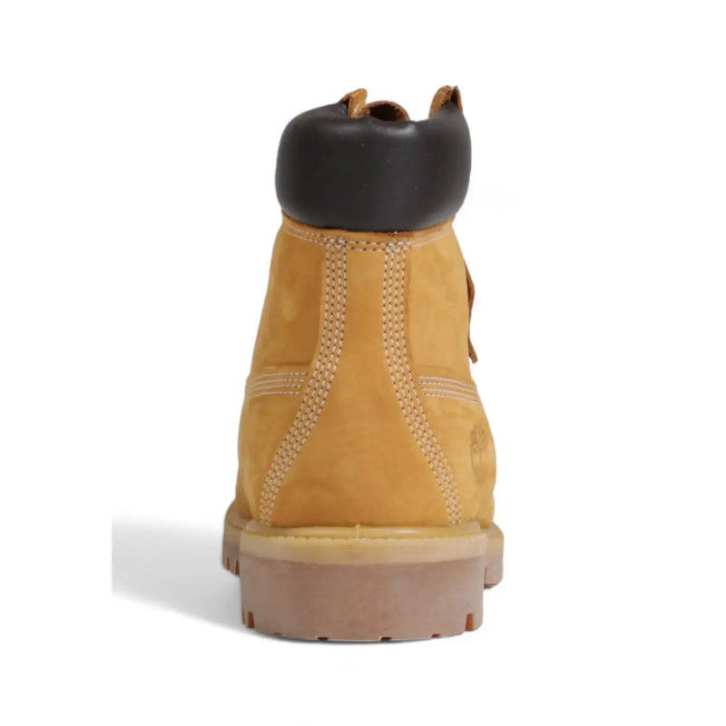 Timberland men’s brown leather slip on boots featuring tan suede 6 inch design with black rubber toe cap and tan outsole