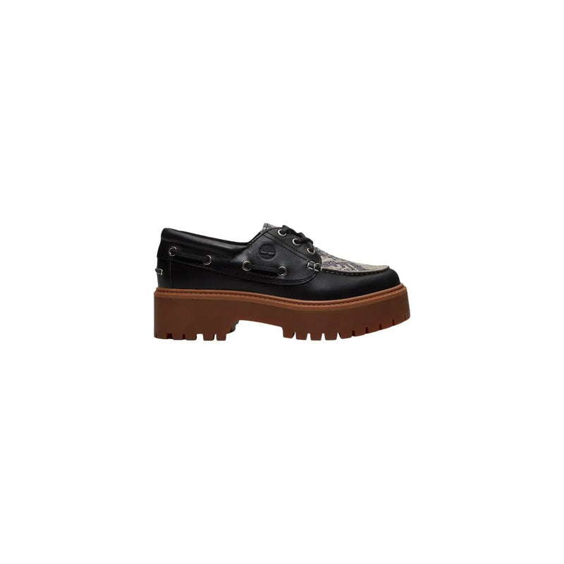 Timberland women leather platform shoe in black with a textured toe cap and brown rubber sole