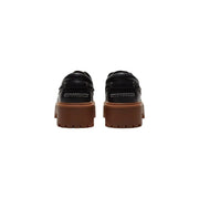 Timberland women leather platform shoes in black featuring black leather loafers with chunky brown rubber soles and white stitching