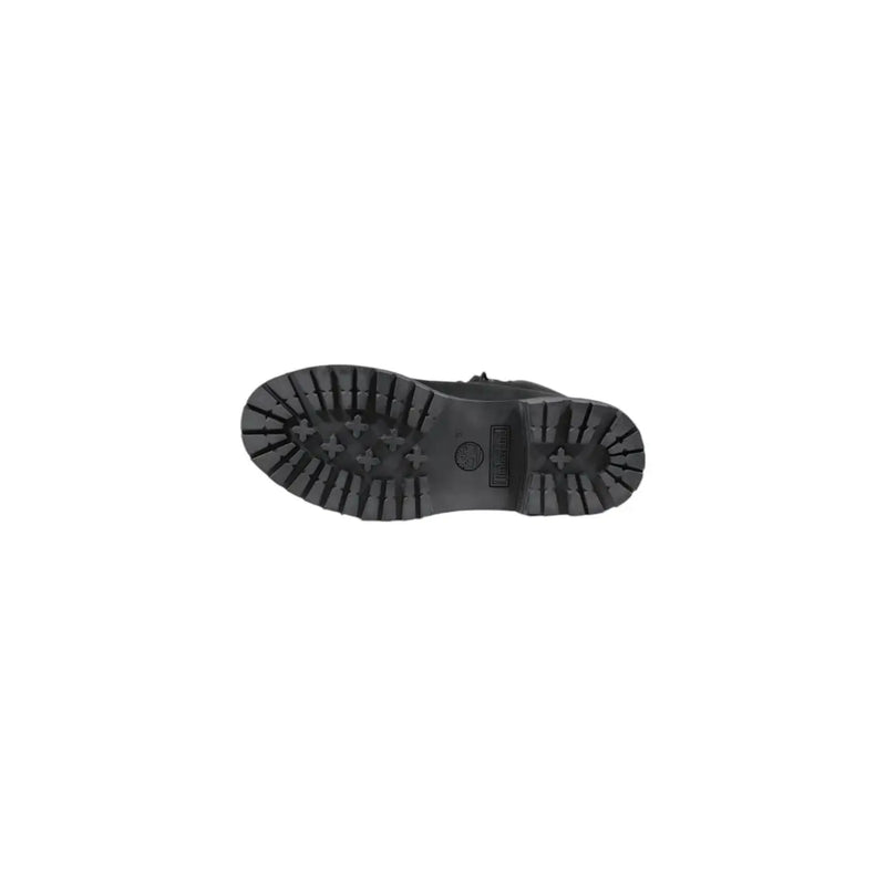 Timberland women’s black leather ankle boots with a rugged textured rubber sole and distinctive cross-shaped tread pattern