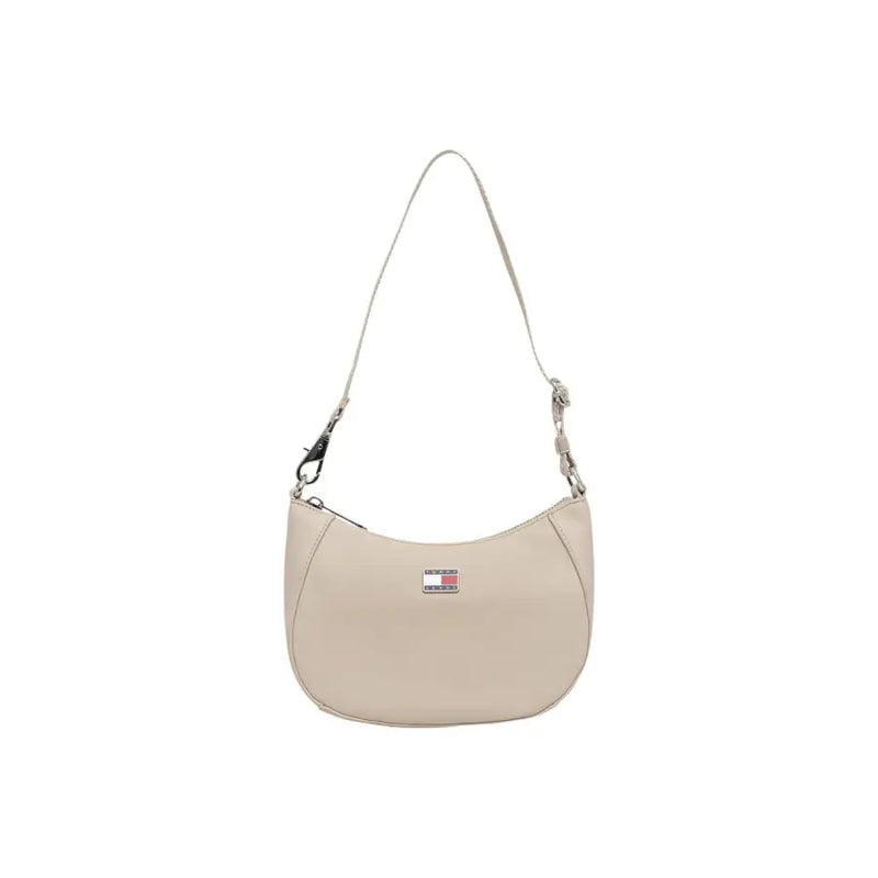 Beige tommy hilfiger women’s shoulder bag with zip pocket and minimalist design featuring a signature flag patch