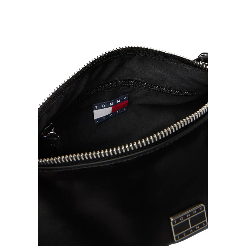 Tommy Hilfiger black faux leather handbag with silver zippers and branded patch and a zip pocket