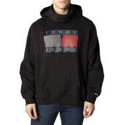 Tommy Hilfiger black hooded sweatshirt for men with bold graphic logo and gray red diagonal stripes on dark blue background
