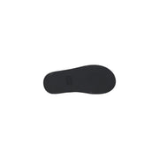 Black rubber sole with minimalist design and subtle brand logo on Tommy Hilfiger black leather wedge shoes for women