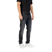 Black slim fit jeans with white stitching and pockets, made of denim material.