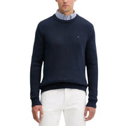 Tommy hilfiger navy blue crewneck sweater with white pants.