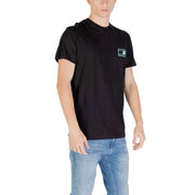 Tommy Hilfiger black short sleeved t shirt with a small teal and white rectangular logo patch on the left chest