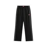 Tommy Hilfiger black women’s spring summer track pants with white side stripes and logo patch on the thigh