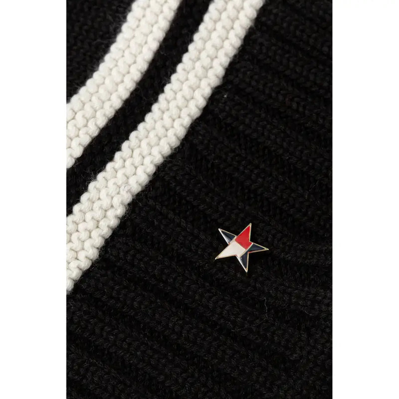 Tommy hilfiger black wool blend womens cap featuring a small three-colored red white and black enamel star pin on knit fabric