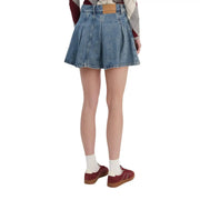 Blue organic cotton denim pleated mini skirt for women by Tommy Hilfiger with brown leather brand patch at waistband