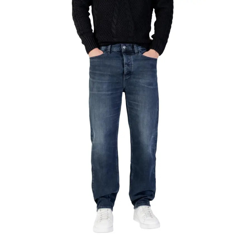 Dark blue denim jeans with a relaxed fit and white stitching, likely from levi’s 501 model.