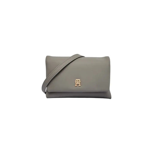 Grey leather Tommy Hilfiger crossbody bag with gold-tone emblem and inside pocket