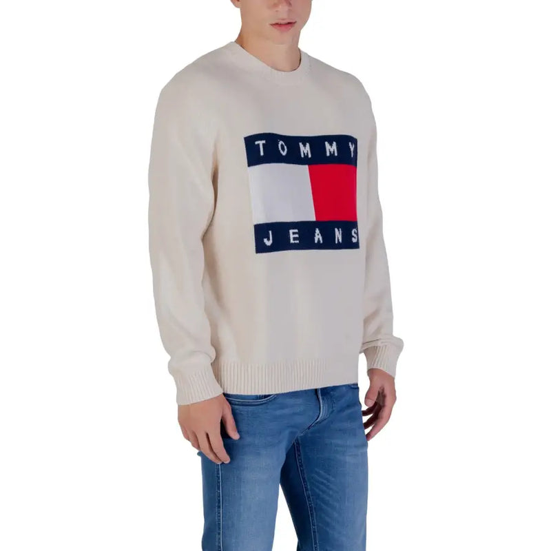 Tommy jeans cream-colored sweater with a bold red, white and blue logo.