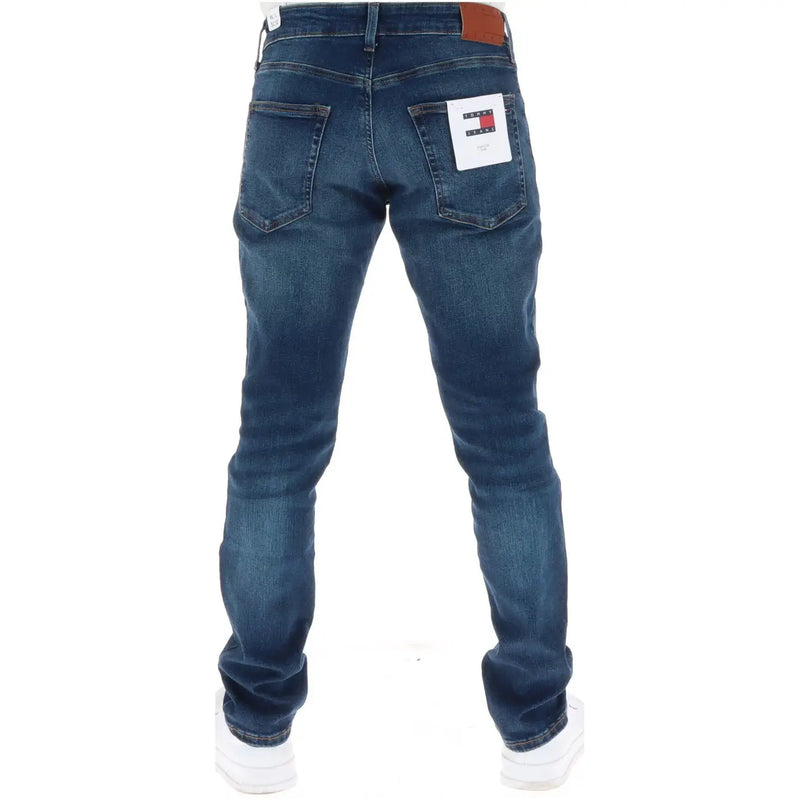 Tommy Hilfiger jeans for men in dark blue denim with brown leather waistband and white brand tag back view