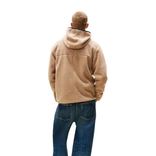 Men’s beige fleece hooded jacket with blue jeans from Tommy Hilfiger Jeans
