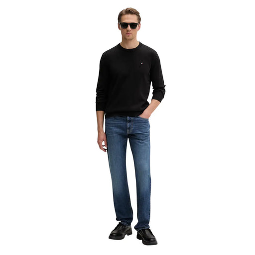 Black long-sleeved crewneck knitwear with small embroidered logo made from organic cotton by Tommy Hilfiger Jeans men