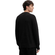 Black ribbed knit crew neck sweater with long sleeves made of organic cotton by Tommy Hilfiger Jeans men