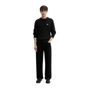 Tommy Hilfiger jeans men black ribbed knit organic cotton sweater with small red and white logo on left chest