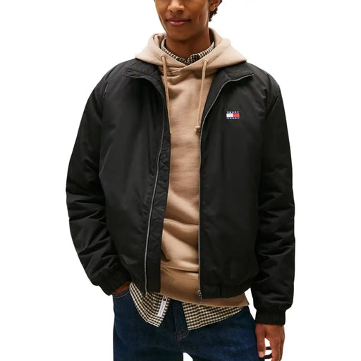Black tommy hilfiger polyester bomber jacket with zip and small red white and blue flag logo on left chest